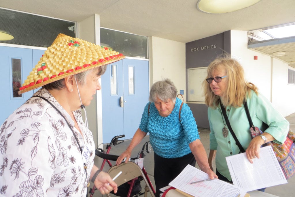 Maggie Goodman (l) getting Reform Prop. 13 petition signatures